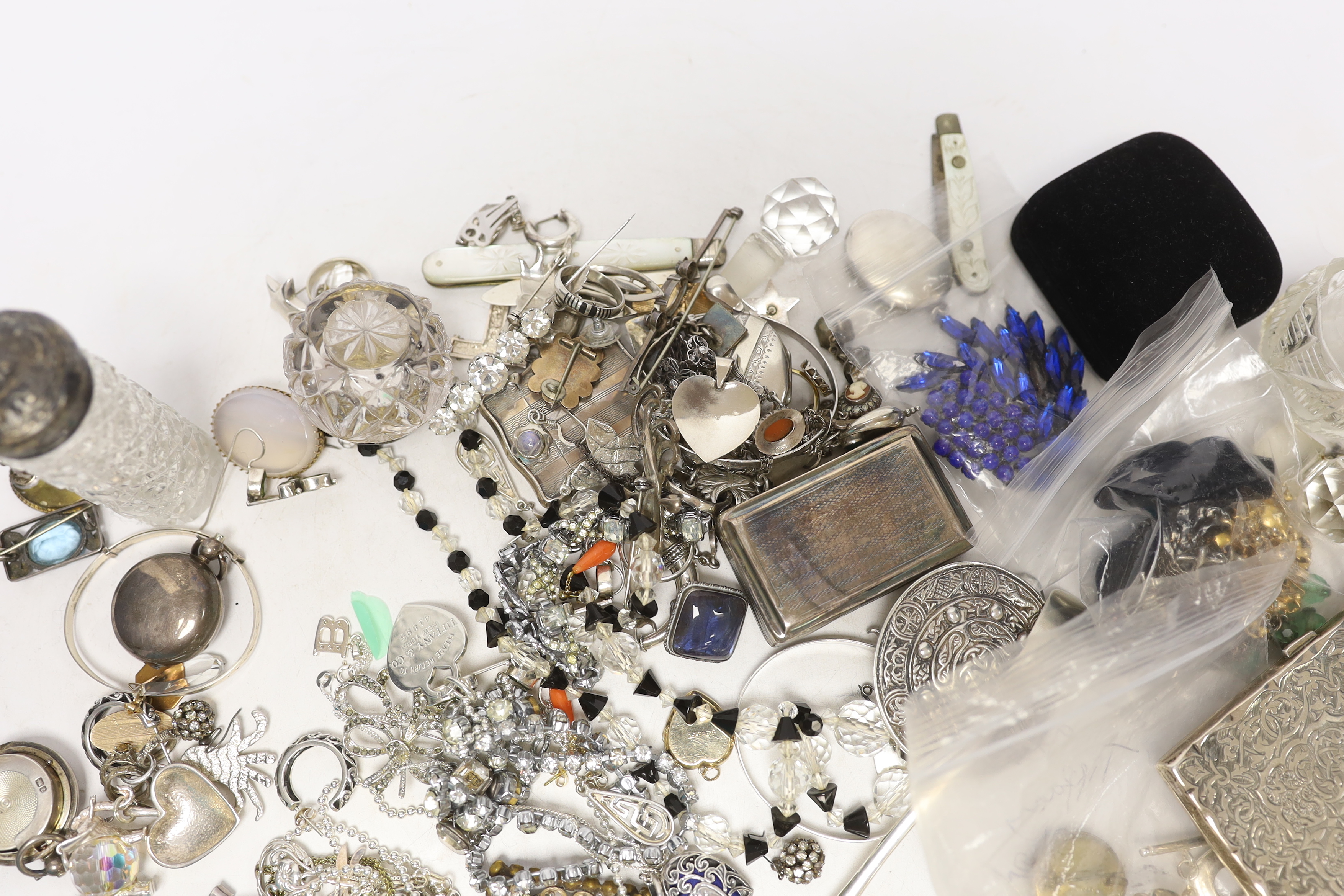 A group of assorted silver and jewellery, including a 19th century snuff box, sifter spoon and card case, a later toilet jar, scent bottle and sovereign case, necklaces, earrings and lockets including white metal and oth